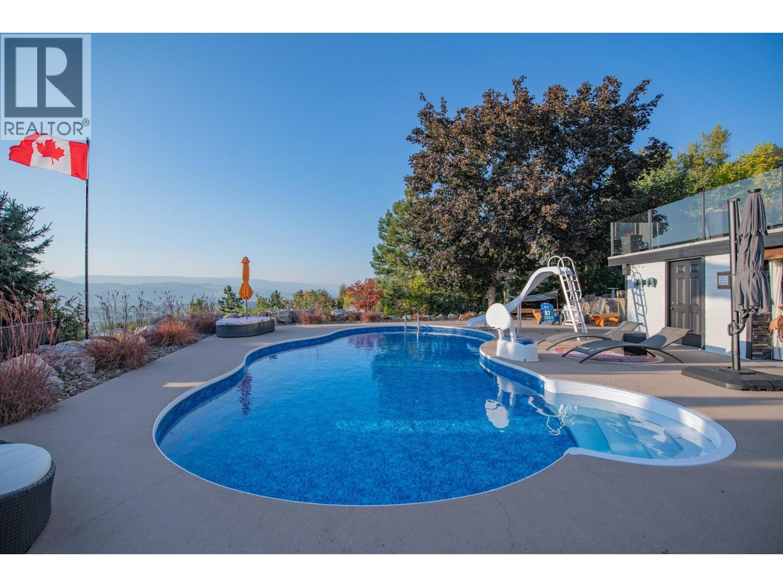 702 Cypress Drive, Coldstream, BC - Outdoor With In Ground Pool With Deck Patio Veranda