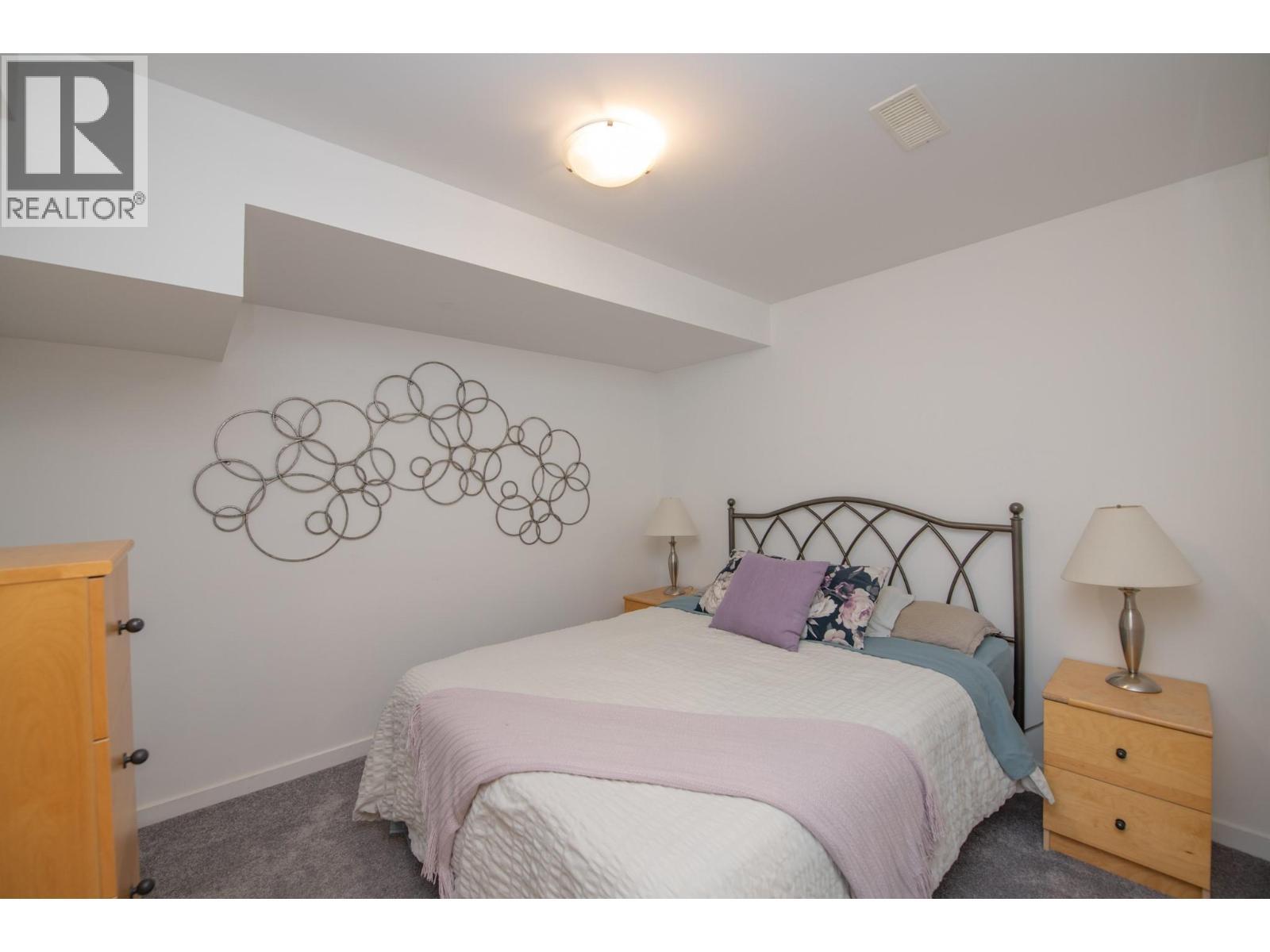 Craft room or den...currently has a bed in it. - 702 Cypress Drive, Coldstream, BC - Indoor Photo Showing Bedroom