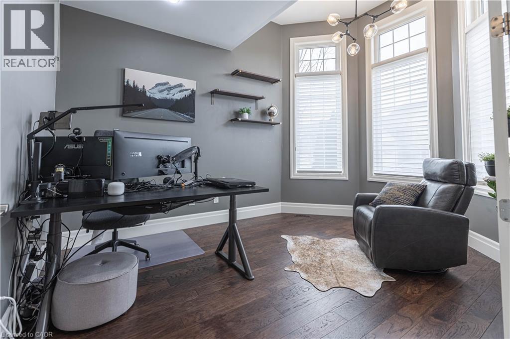 Office space featuring dark wood finished floors and baseboards - 2719 Torrey Pines Way, London, ON - Indoor