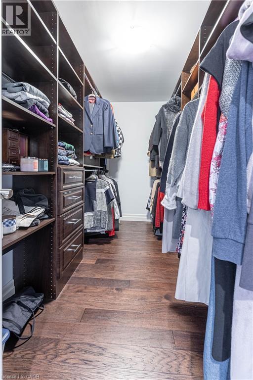Walk in closet with dark wood-type flooring - 2719 Torrey Pines Way, London, ON - Indoor With Storage
