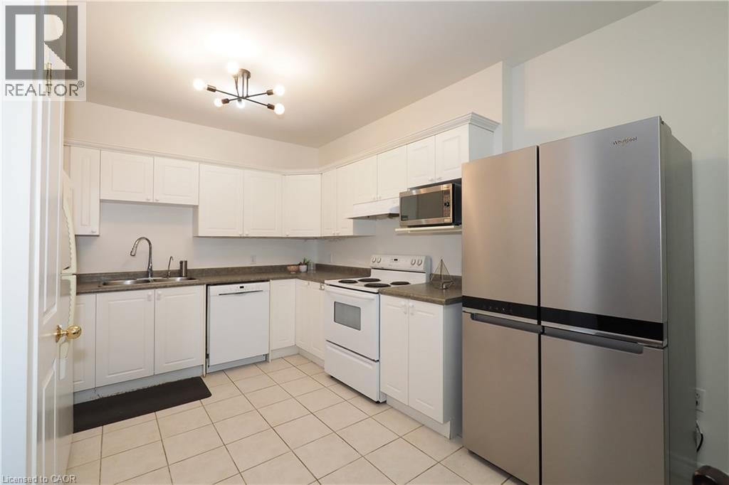 255 Keats Way Unit# 701, Waterloo, ON - Indoor Photo Showing Kitchen With Double Sink