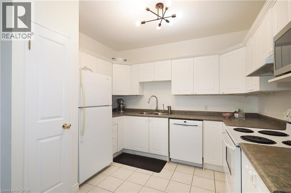 255 Keats Way Unit# 701, Waterloo, ON - Indoor Photo Showing Kitchen With Double Sink