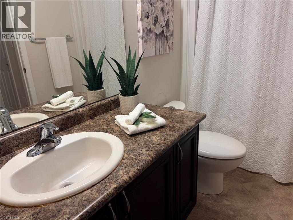 Full bathroom featuring vanity and curtained shower - 776 Laurelwood Drive Unit# 406, Waterloo, ON - Indoor Photo Showing Bathroom