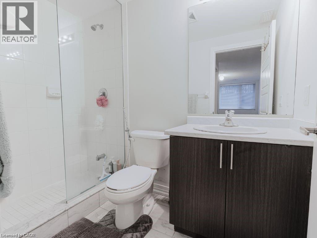 Full bath featuring vanity and tiled shower - 1206 Main Street E Unit# 113, Milton, ON - Indoor Photo Showing Bathroom