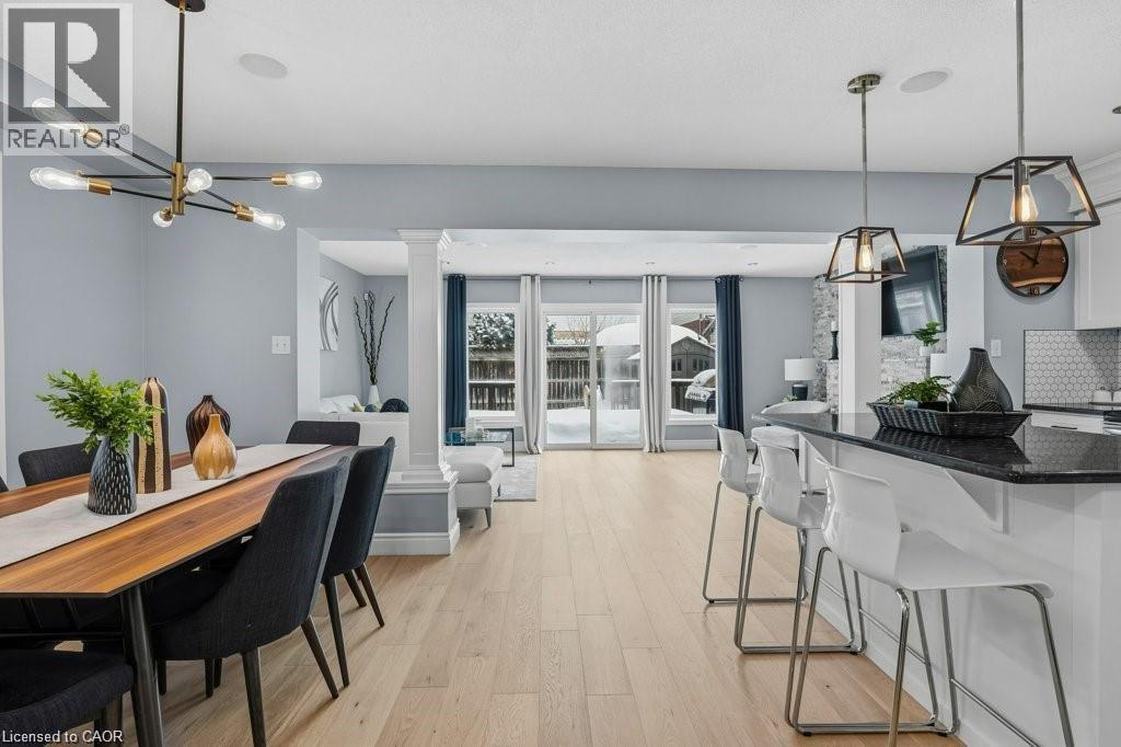 Stunning mainfloor with upgraded kitchen, new flooring, patio door walkout, and more! - 26 Helena Feasby Street, Kitchener, ON - Indoor Photo Showing Dining Room