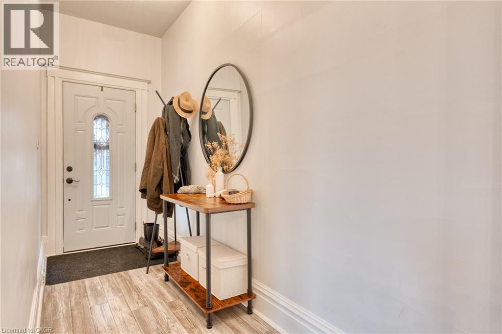 Foyer entrance with light wood-type flooring and baseboards - 37 Cliff Avenue, Hamilton, ON - Indoor Photo Showing Other Room