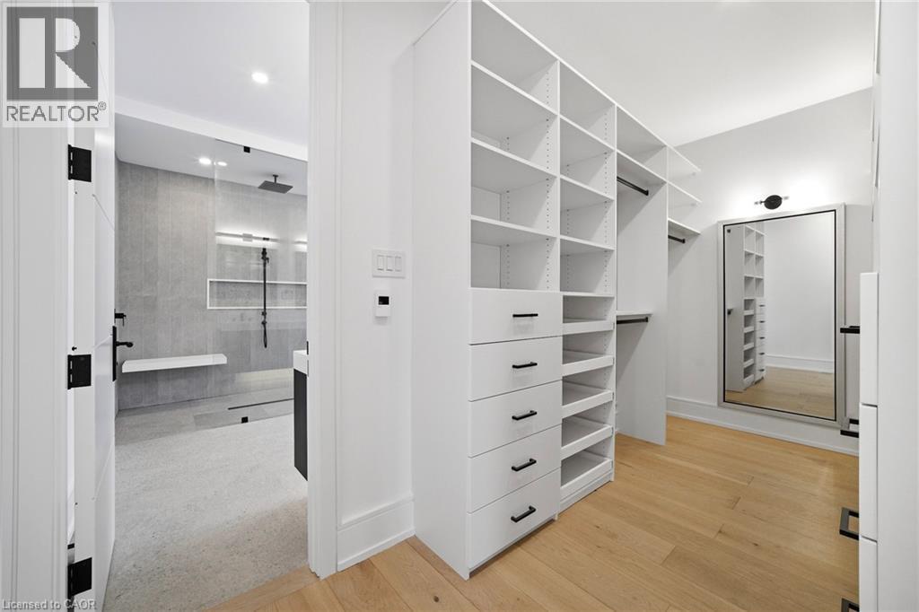 Walk in closet featuring light wood-style floors - 2556 Glengarry Road, Mississauga, ON - Indoor