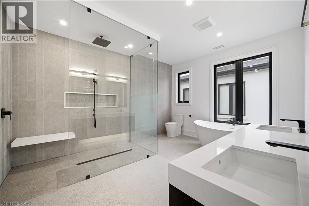 Full bathroom with double vanity, a walk in shower, recessed lighting, and dark speckled floor - 2556 Glengarry Road, Mississauga, ON - Indoor Photo Showing Bathroom