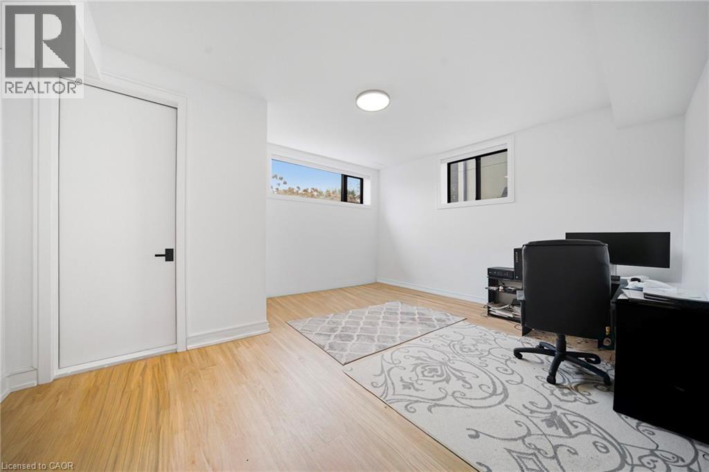 Office area featuring light wood-type flooring and baseboards - 2556 Glengarry Road, Mississauga, ON - Indoor