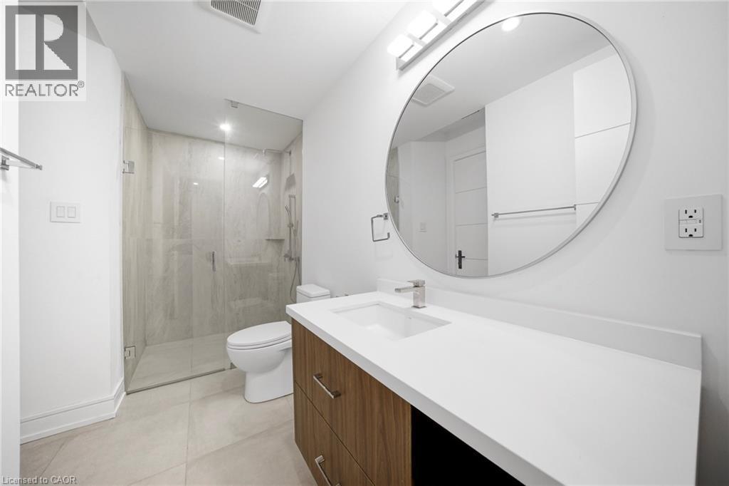 Full bathroom with vanity, a shower stall, and light tile patterned flooring - 2556 Glengarry Road, Mississauga, ON - Indoor Photo Showing Bathroom
