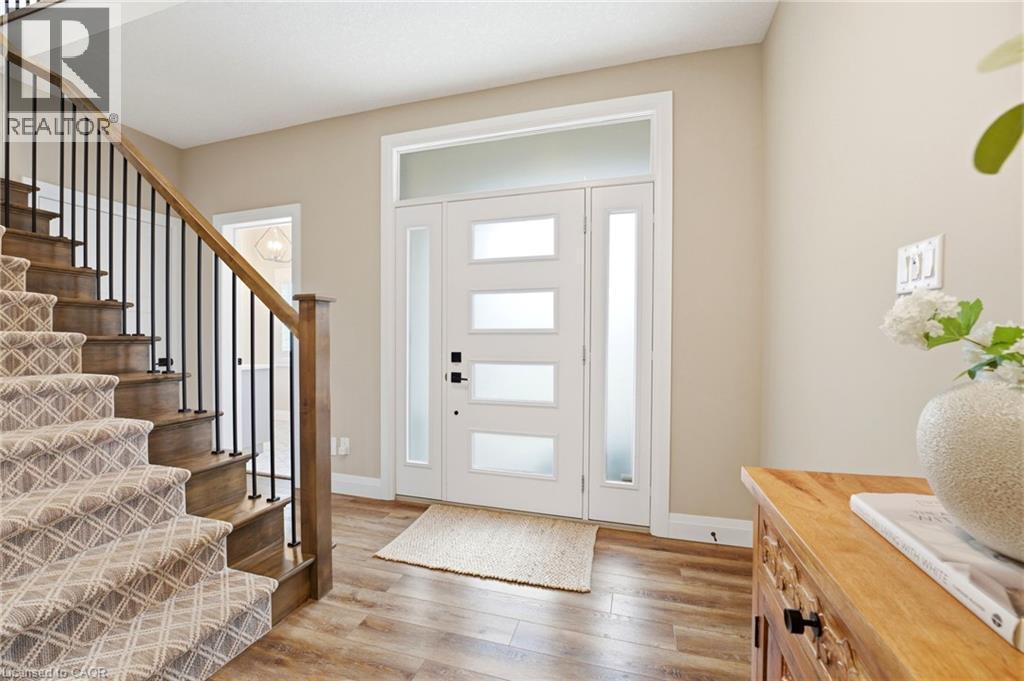 Entryway featuring stairway and light wood-style floors - 39 Mill Race Crescent, St. Jacobs, ON - Indoor Photo Showing Other Room