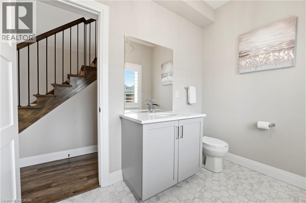 Half bathroom featuring baseboards and vanity - 39 Mill Race Crescent, St. Jacobs, ON - Indoor Photo Showing Bathroom