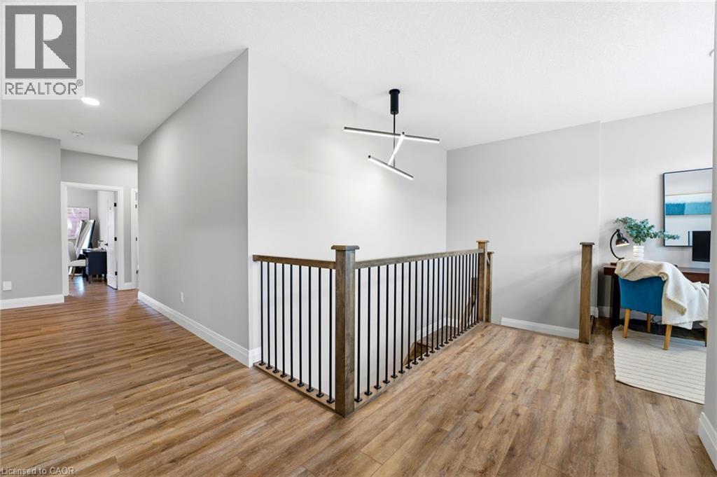 Hallway featuring light wood-type flooring, recessed lighting, and an upstairs landing - 39 Mill Race Crescent, St. Jacobs, ON - Indoor Photo Showing Other Room