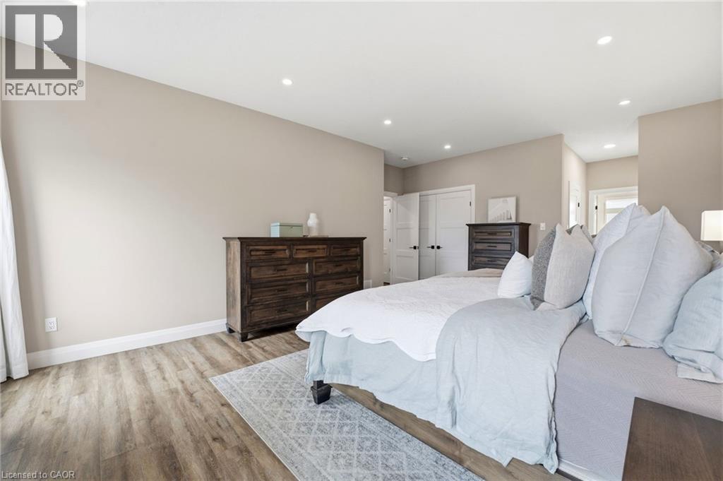 Bedroom with light wood-style flooring, recessed lighting, and a closet - 39 Mill Race Crescent, St. Jacobs, ON - Indoor Photo Showing Bedroom
