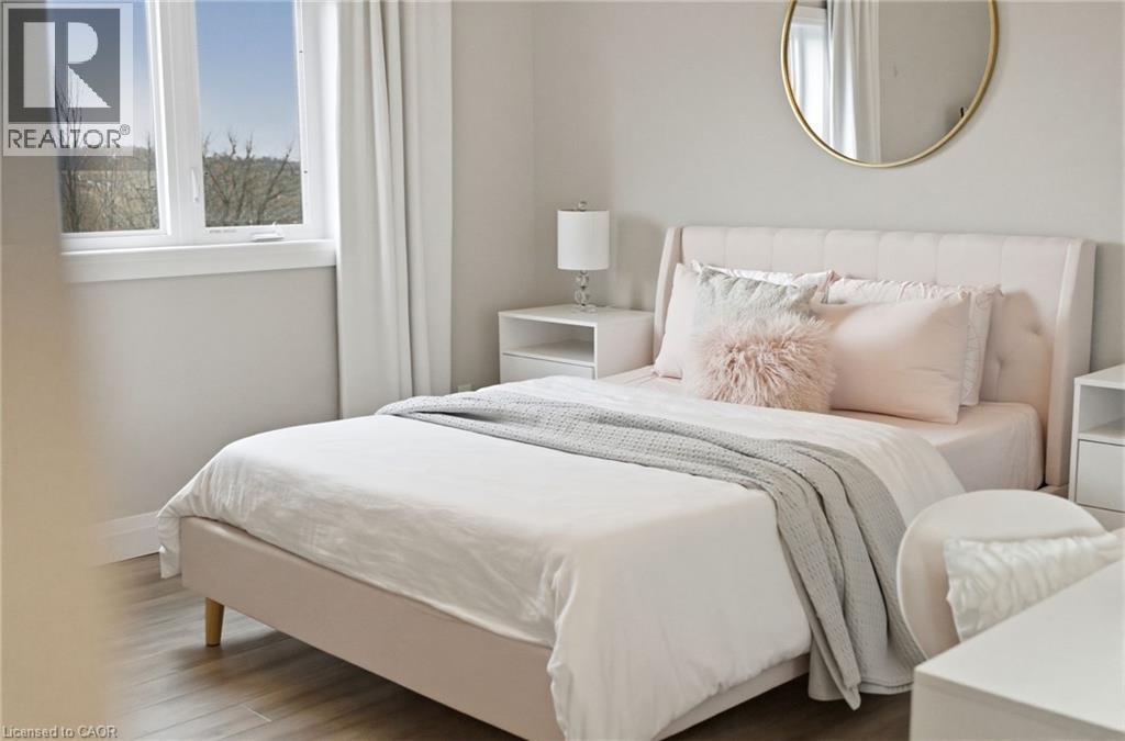 Bedroom featuring wood finished floors - 39 Mill Race Crescent, St. Jacobs, ON - Indoor Photo Showing Bedroom