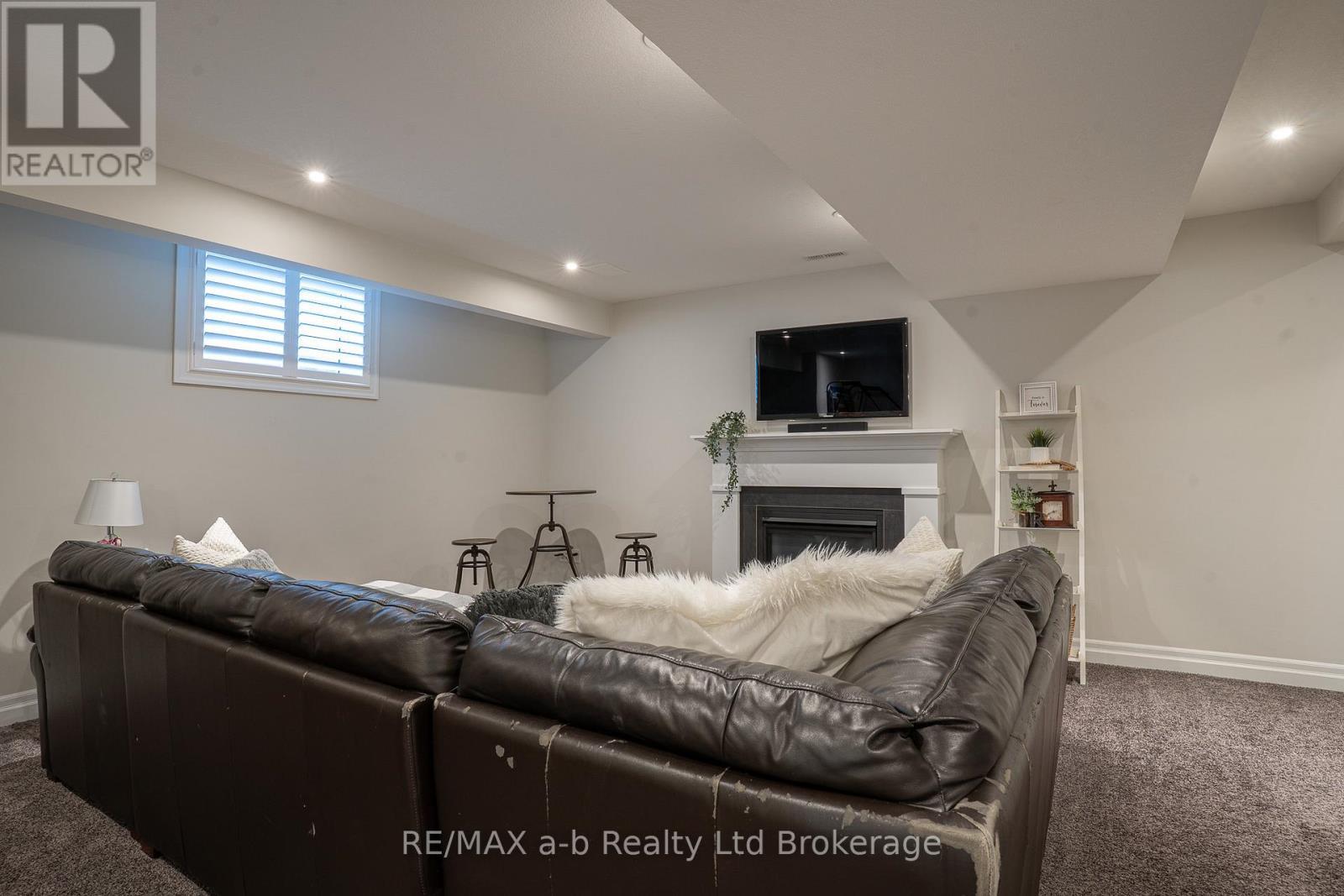 30 Brookside Lane, Tillsonburg, ON - Indoor Photo Showing Basement With Fireplace