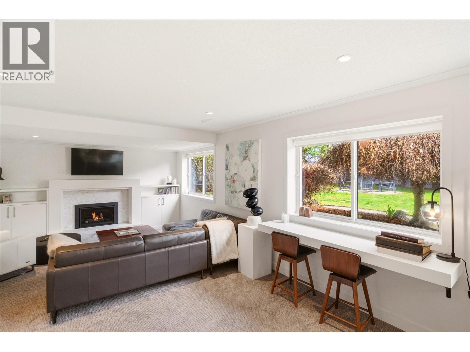 TV room - 4337 Dunvegan Court, Kelowna, BC - Indoor Photo Showing Living Room With Fireplace