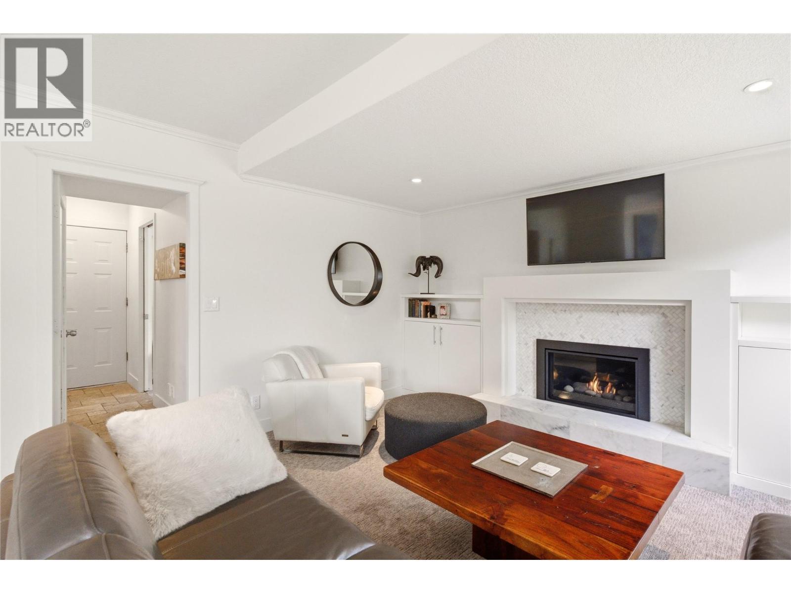 TV room - 4337 Dunvegan Court, Kelowna, BC - Indoor Photo Showing Living Room With Fireplace