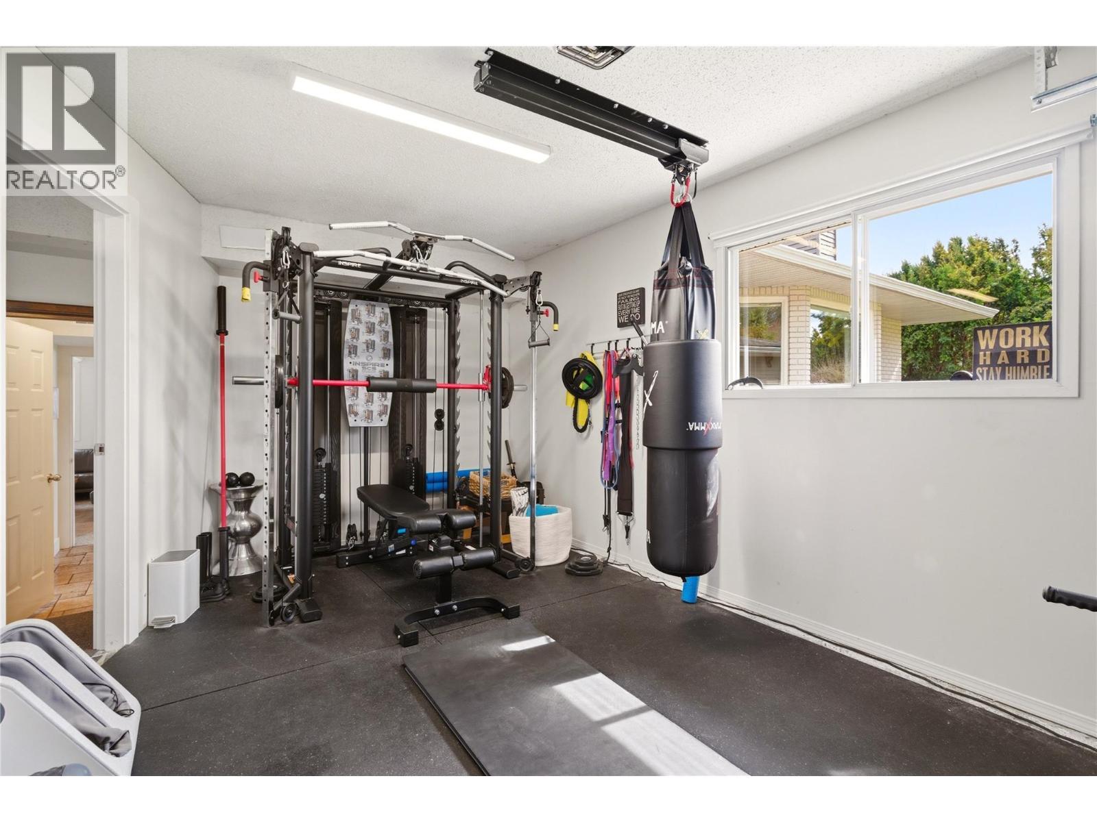 Garage - 4337 Dunvegan Court, Kelowna, BC - Indoor Photo Showing Gym Room