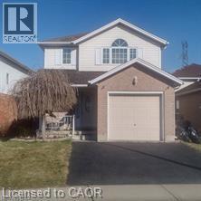 Traditional-style home featuring driveway and a garage - 230 Grey Fox Drive, Kitchener, ON - Outdoor