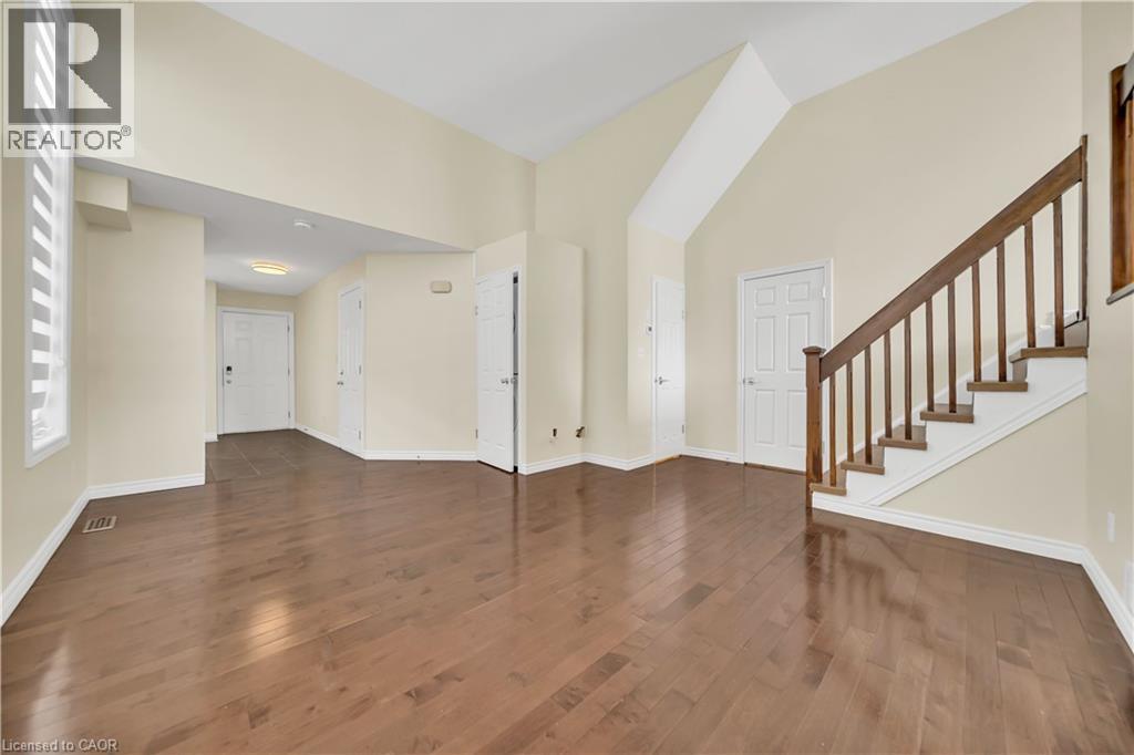 Foyer entrance featuring a high ceiling and dark wood-style flooring - 51 Seabrook Drive, Kitchener, ON - Indoor Photo Showing Other Room
