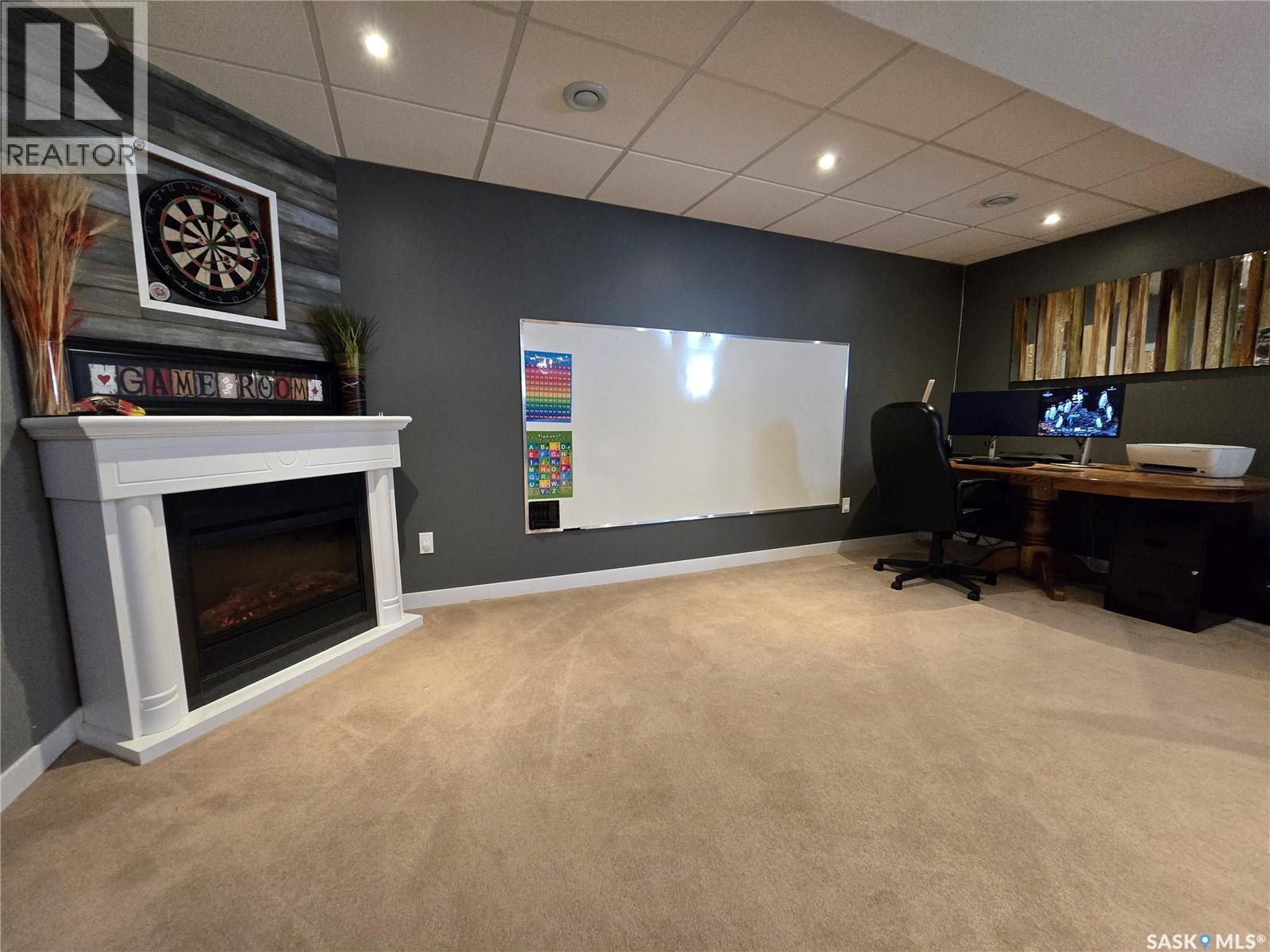 752 Mctaggart Drive, Weyburn, SK - Indoor With Fireplace