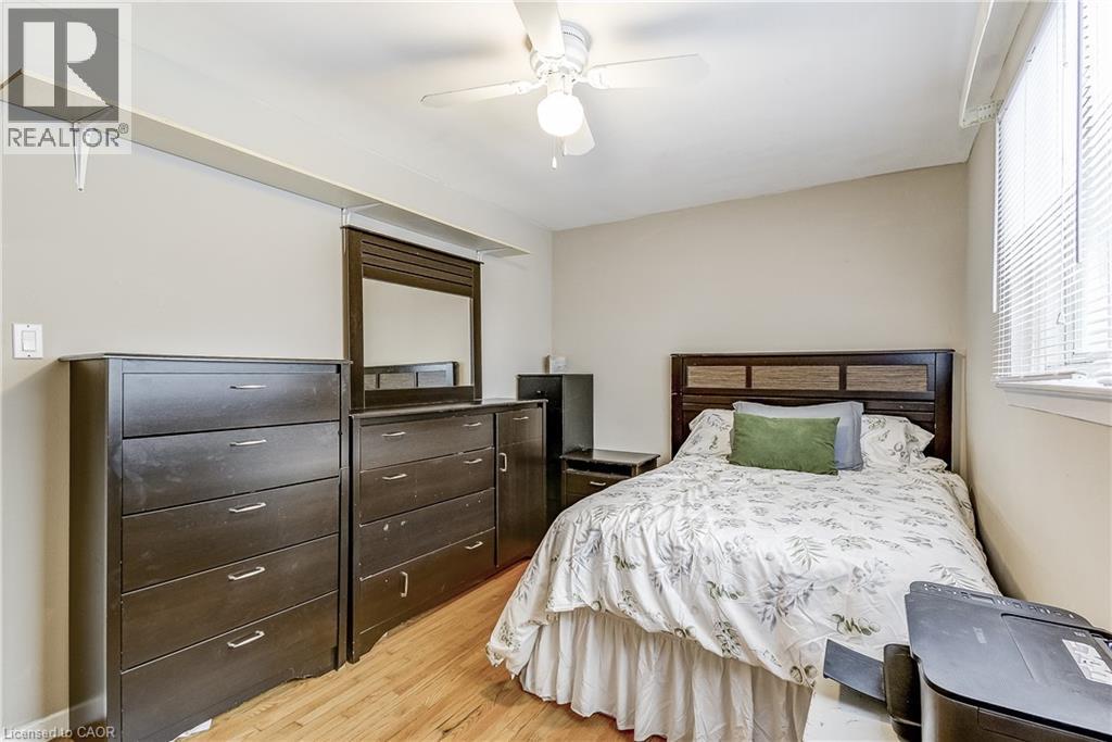 Bedroom featuring light wood-style floors and a ceiling fan - 2145 Sandringham Drive, Burlington, ON - Indoor Photo Showing Bedroom