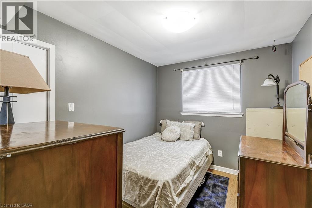 Bedroom with wood finished floors and baseboards - 2145 Sandringham Drive, Burlington, ON - Indoor Photo Showing Bedroom