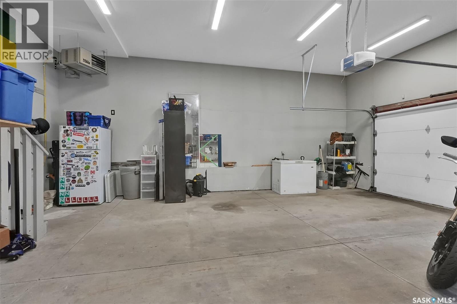 28 Emerald Creek Drive, White City, SK - Indoor Photo Showing Garage