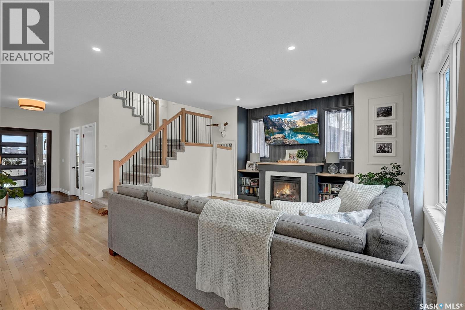 28 Emerald Creek Drive, White City, SK - Indoor Photo Showing Living Room With Fireplace