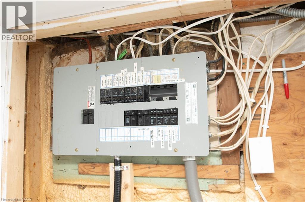 Utility room featuring electric panel - 535 Mcdowell Road E, Simcoe, ON