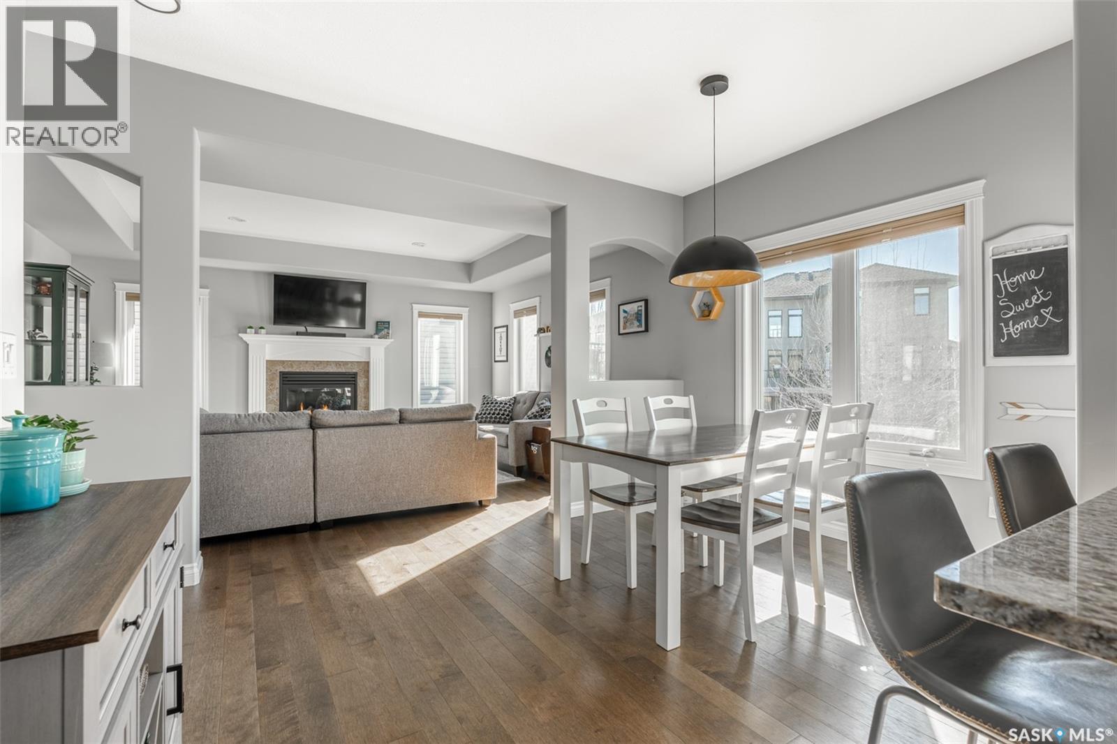 562 Evergreen Boulevard, Saskatoon, SK - Indoor Photo Showing Dining Room With Fireplace