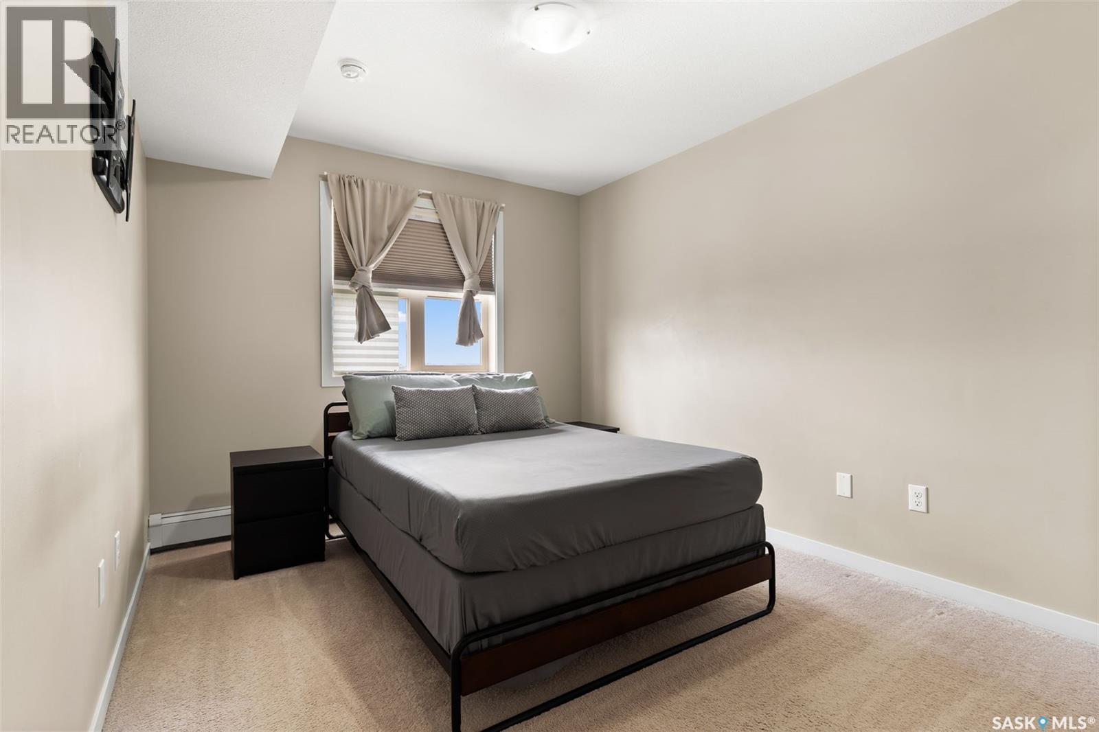 1404 5500 Mitchinson Way, Regina, SK - Indoor Photo Showing Bedroom
