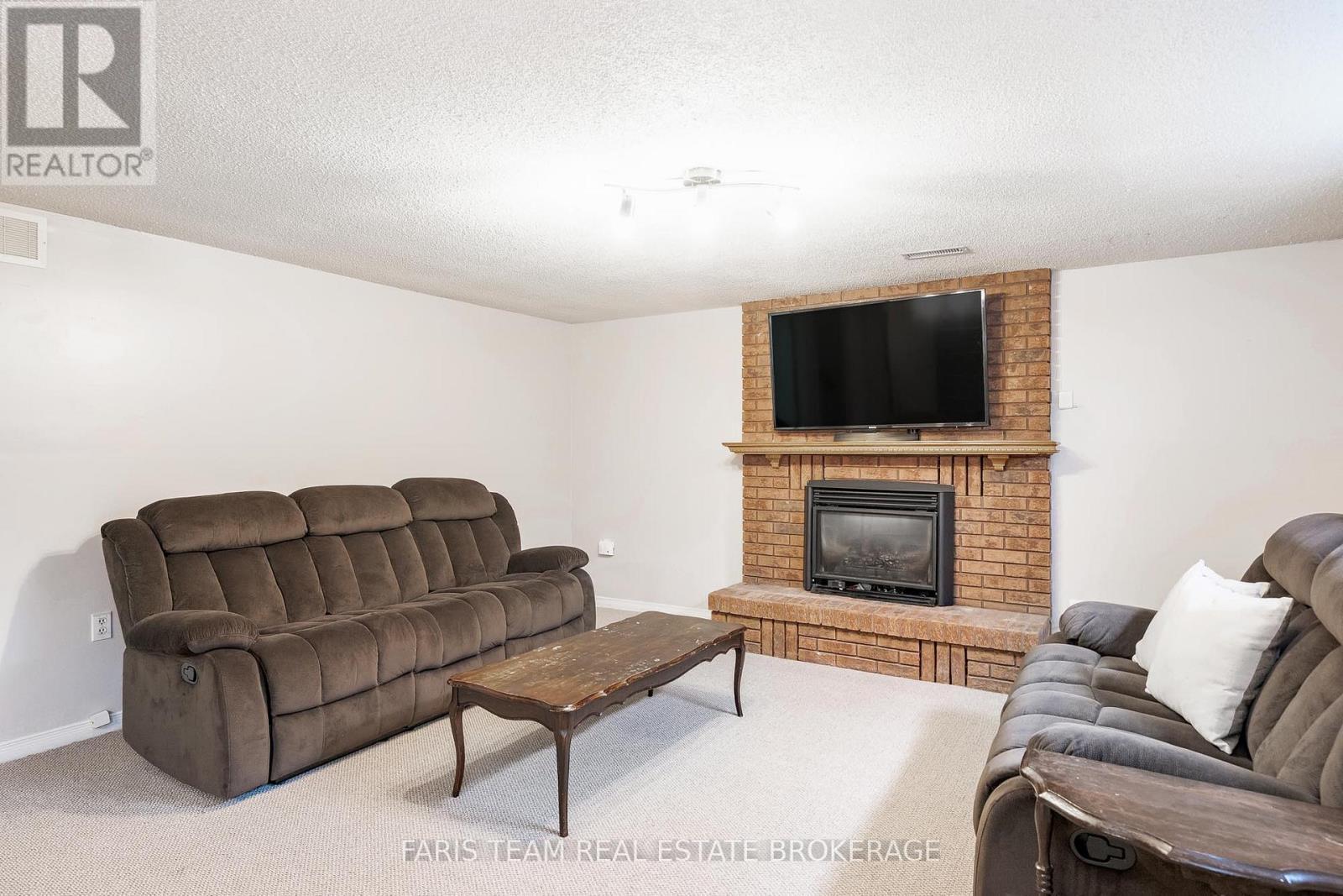 24 Laurie Crescent, Barrie, ON - Indoor Photo Showing Living Room With Fireplace