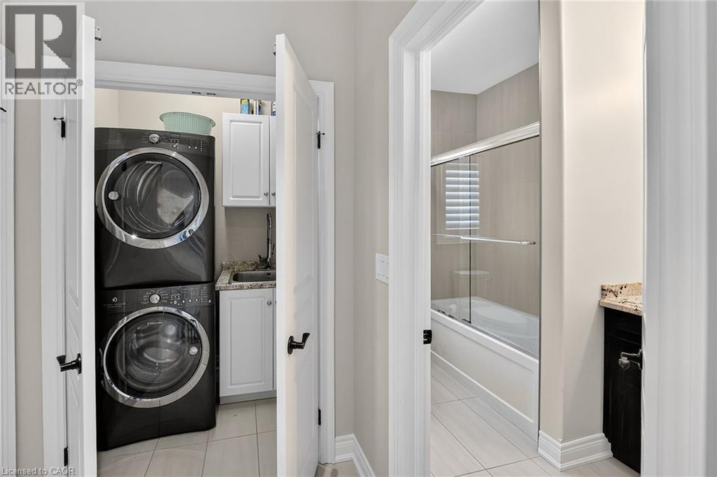 Main floor stackable laundry - 1 Cedar Drive, St. Davids, ON - Indoor Photo Showing Laundry Room