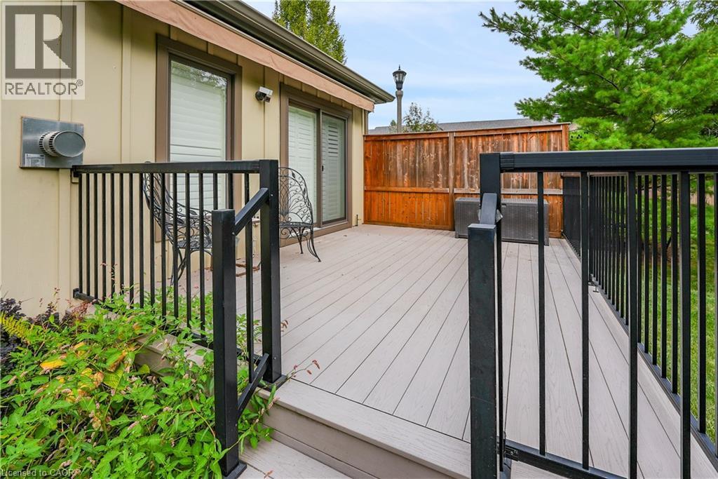 Large composite deck with electric awning - 1 Cedar Drive, St. Davids, ON - Outdoor With Deck Patio Veranda With Exterior
