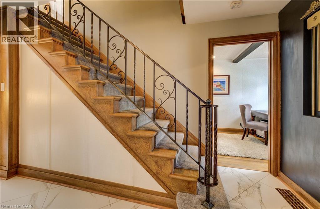 Staircase with original character detail - 27 Lowrey Avenue S, Cambridge, ON - Indoor Photo Showing Other Room