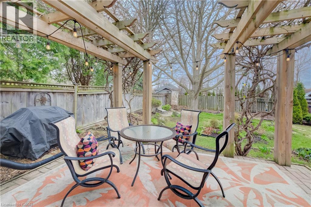 featuring a pergola with kiwi vines and outdoor dining area - 27 Lowrey Avenue S, Cambridge, ON - Outdoor With Deck Patio Veranda