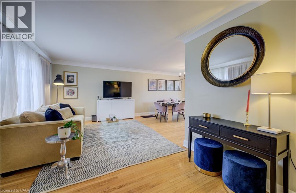 featuring crown molding, hardwood floors, leaded glass window - 27 Lowrey Avenue S, Cambridge, ON - Indoor Photo Showing Living Room