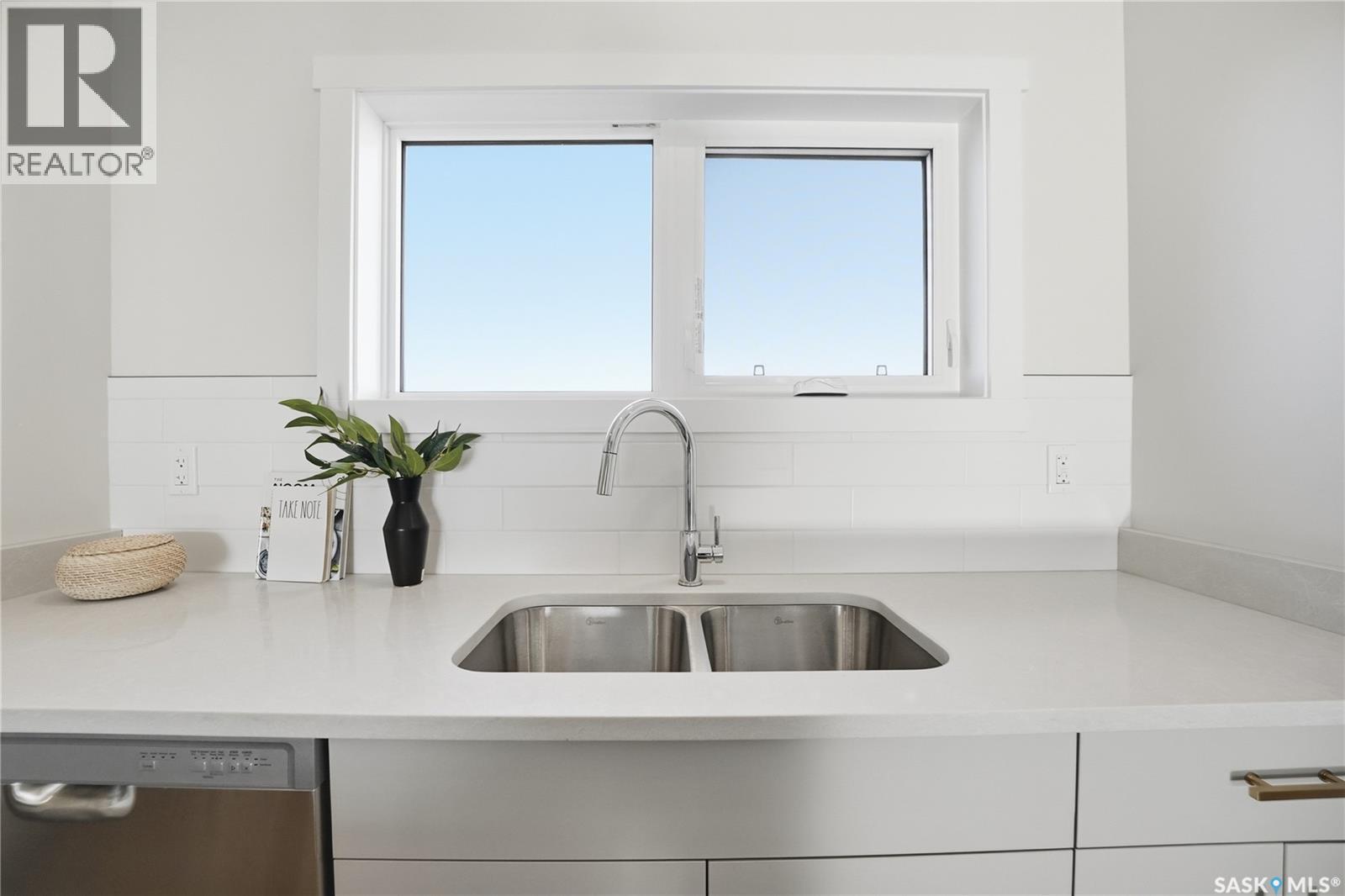 18 Taskamanwa Terrace, Saskatoon, SK - Indoor Photo Showing Kitchen With Double Sink