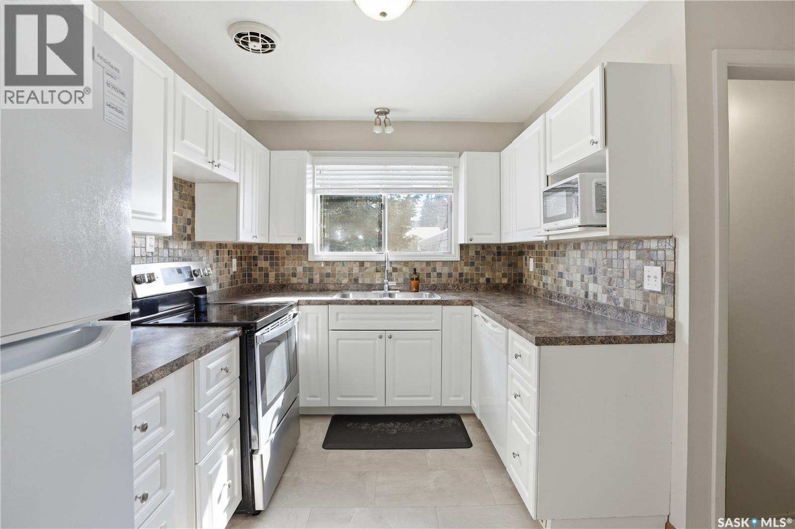 3A & 3B Bateman Crescent, Saskatoon, SK - Indoor Photo Showing Kitchen With Double Sink