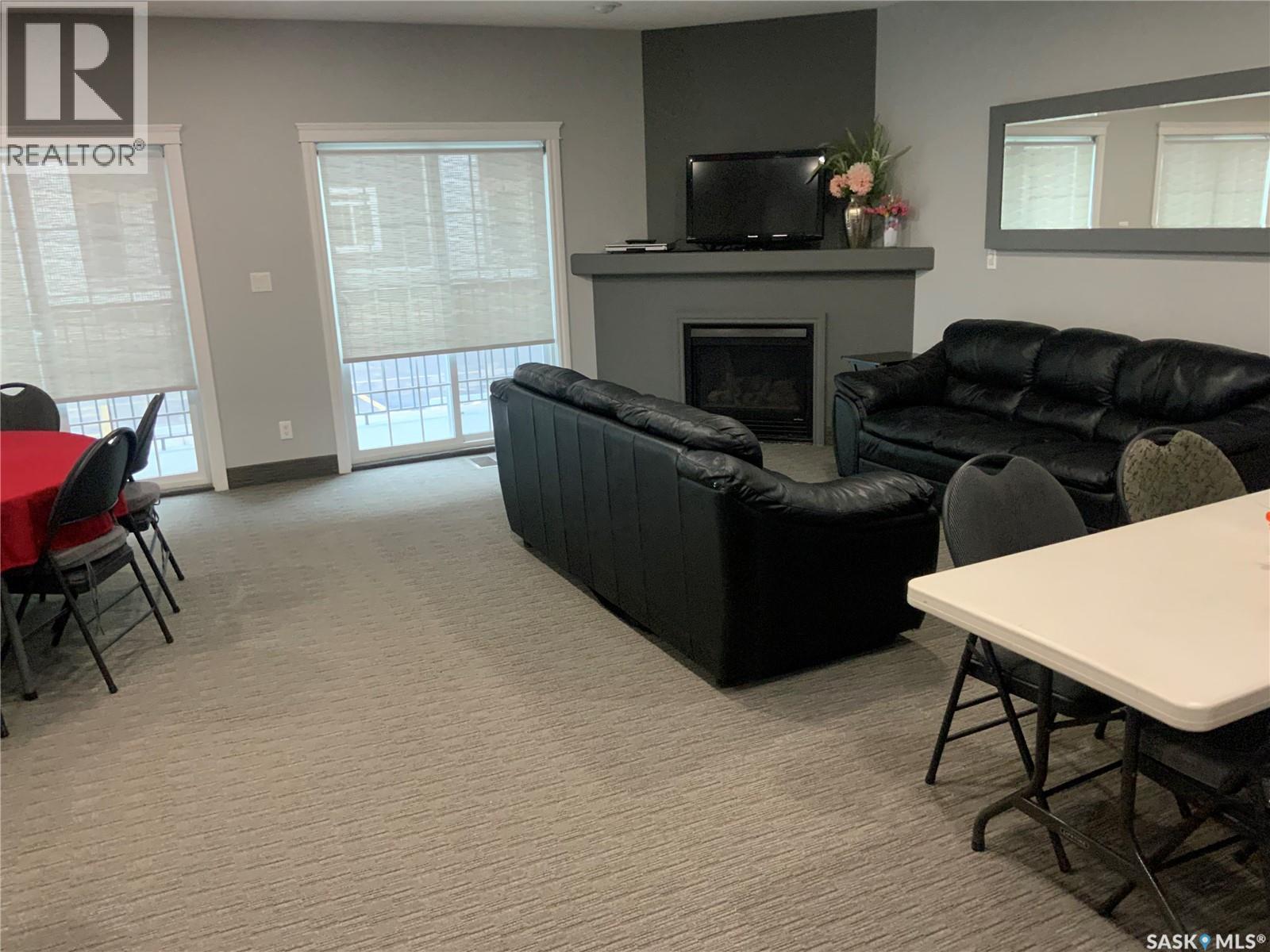403 333 Nelson Road, Saskatoon, SK - Indoor Photo Showing Living Room With Fireplace