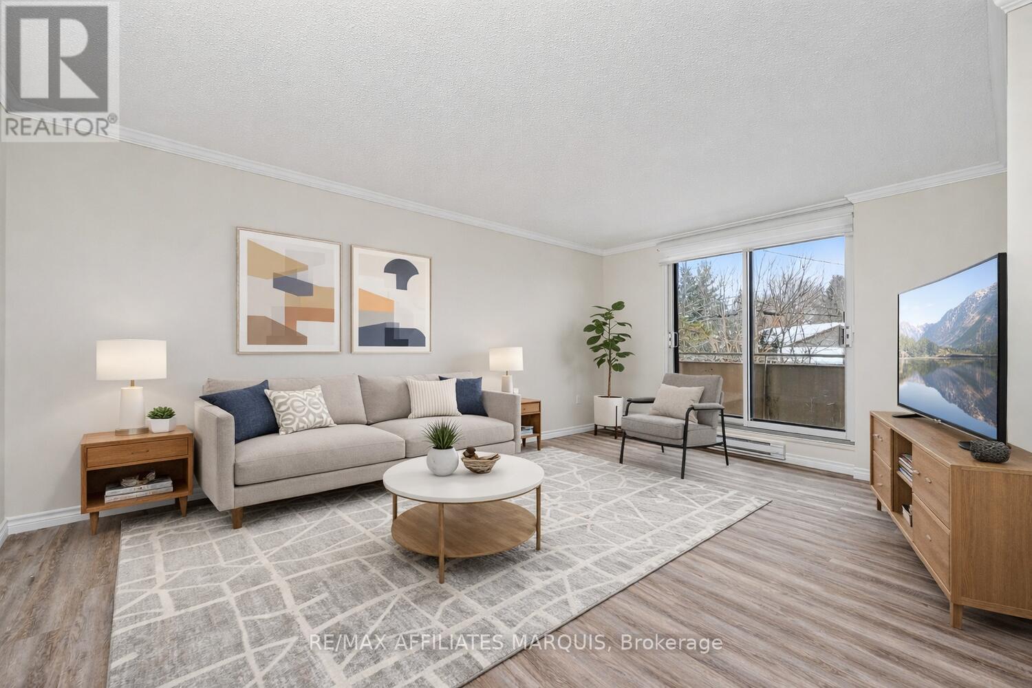 Photo is Virtually Staged - 204 - 41 Sunset Boulevard, Perth, ON - Indoor Photo Showing Living Room
