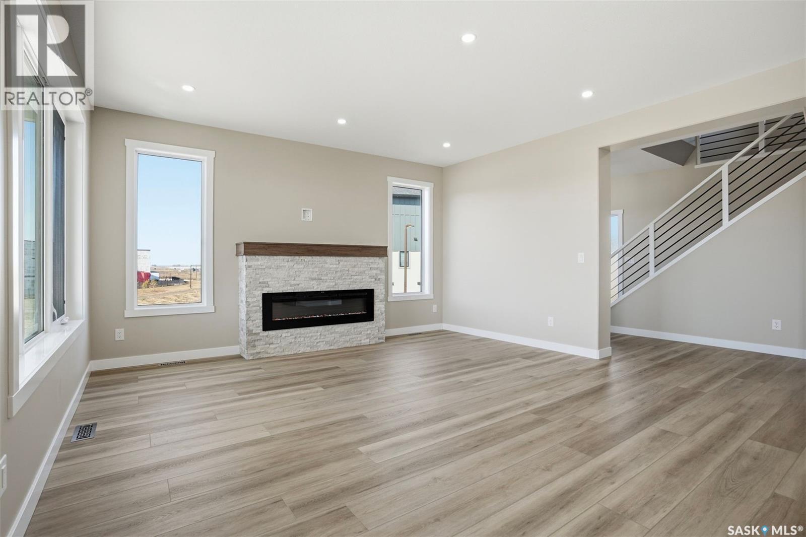 435 Sharma Crescent, Saskatoon, SK - Indoor Photo Showing Living Room With Fireplace