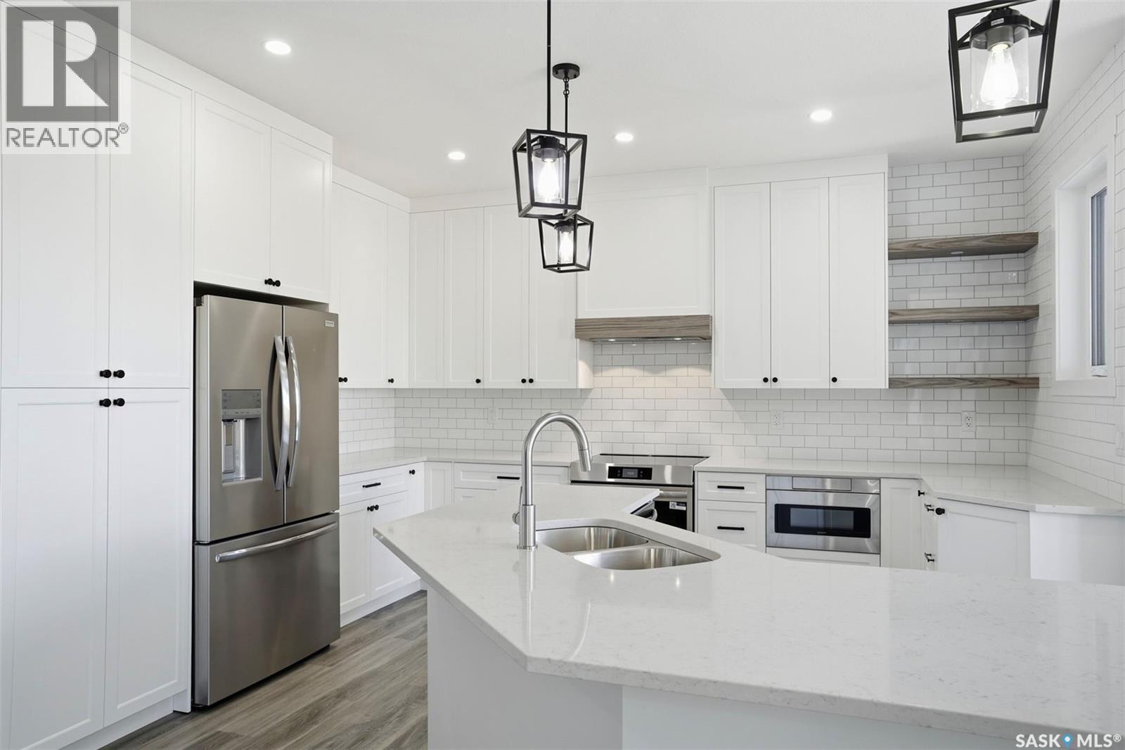 203 Sharma Lane, Saskatoon, SK - Indoor Photo Showing Kitchen With Double Sink With Upgraded Kitchen