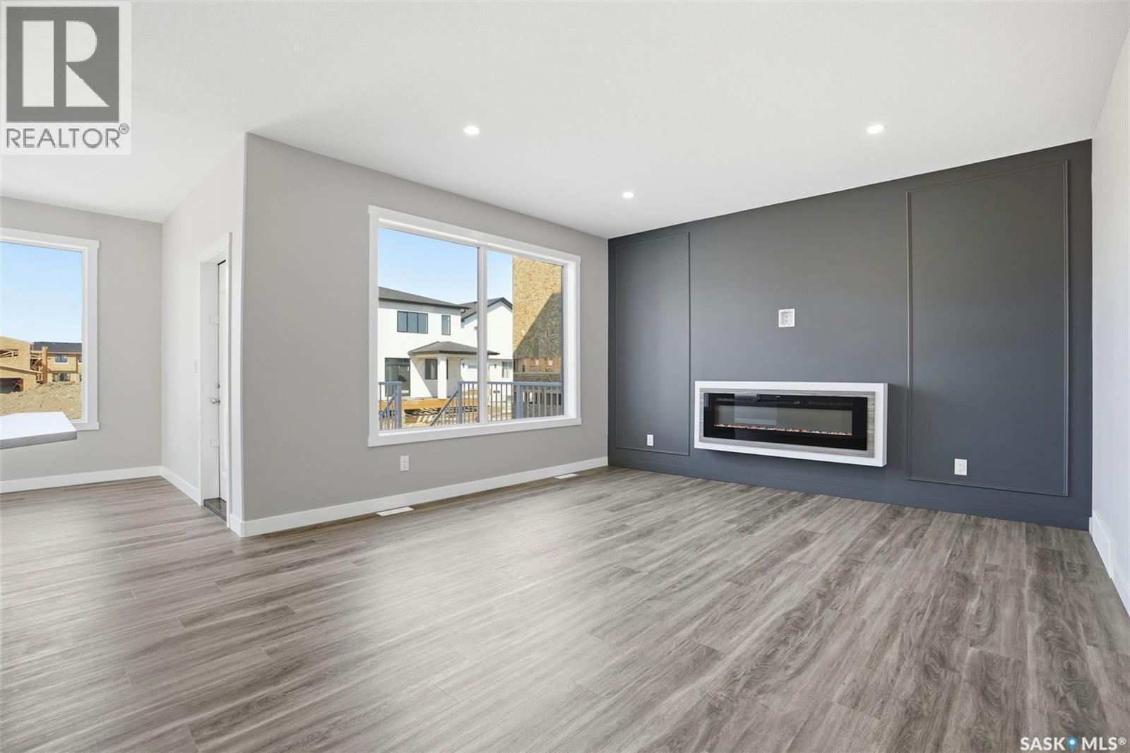 203 Sharma Lane, Saskatoon, SK - Indoor Photo Showing Living Room With Fireplace