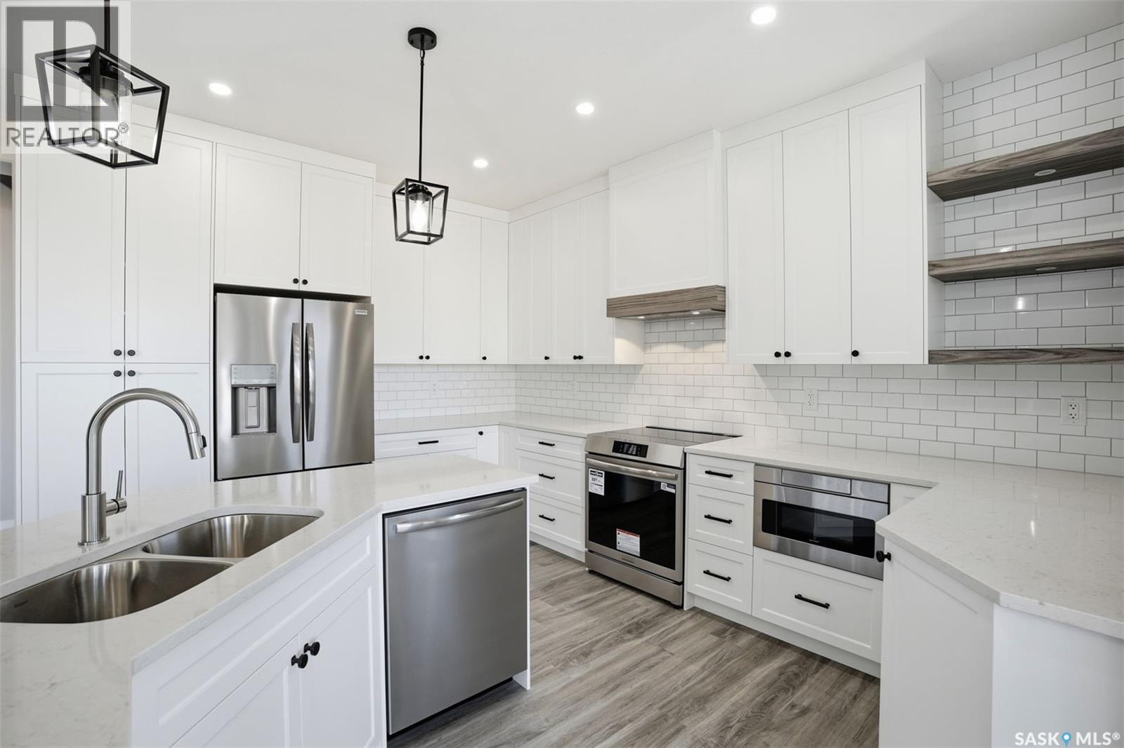 203 Sharma Lane, Saskatoon, SK - Indoor Photo Showing Kitchen With Double Sink With Upgraded Kitchen
