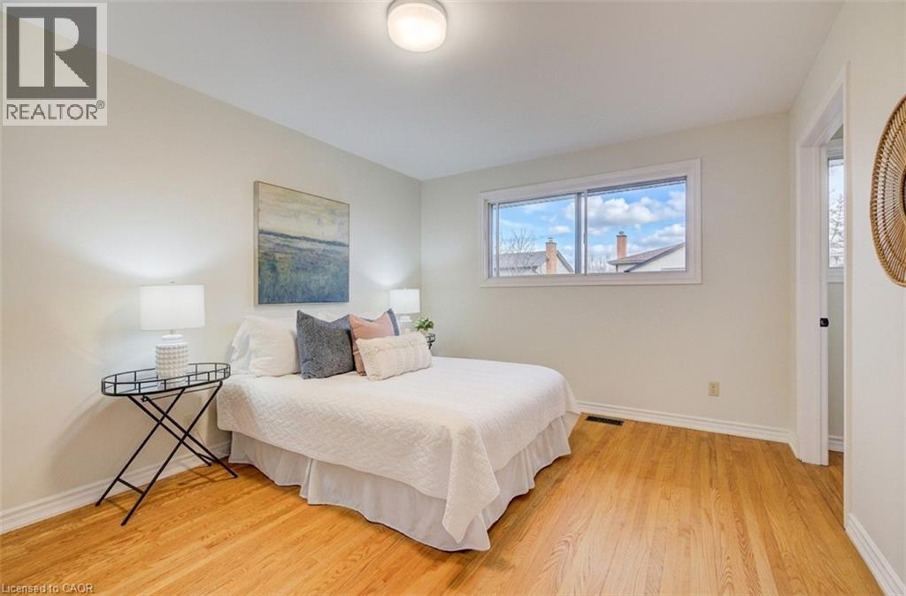 Main floor primary bedroom with ensuite privilege to the 5pc wasroom. - 66 Tupper Crescent, Kitchener, ON - Indoor Photo Showing Bedroom