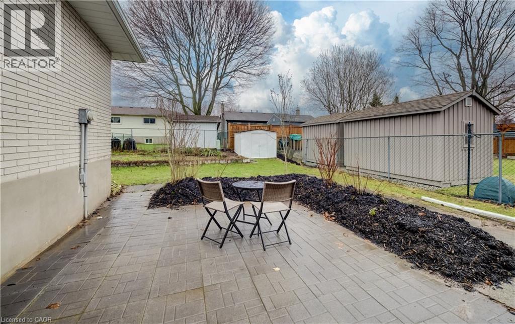 Walk-out to patio with gardens to add your own touch too. - 66 Tupper Crescent, Kitchener, ON - Outdoor