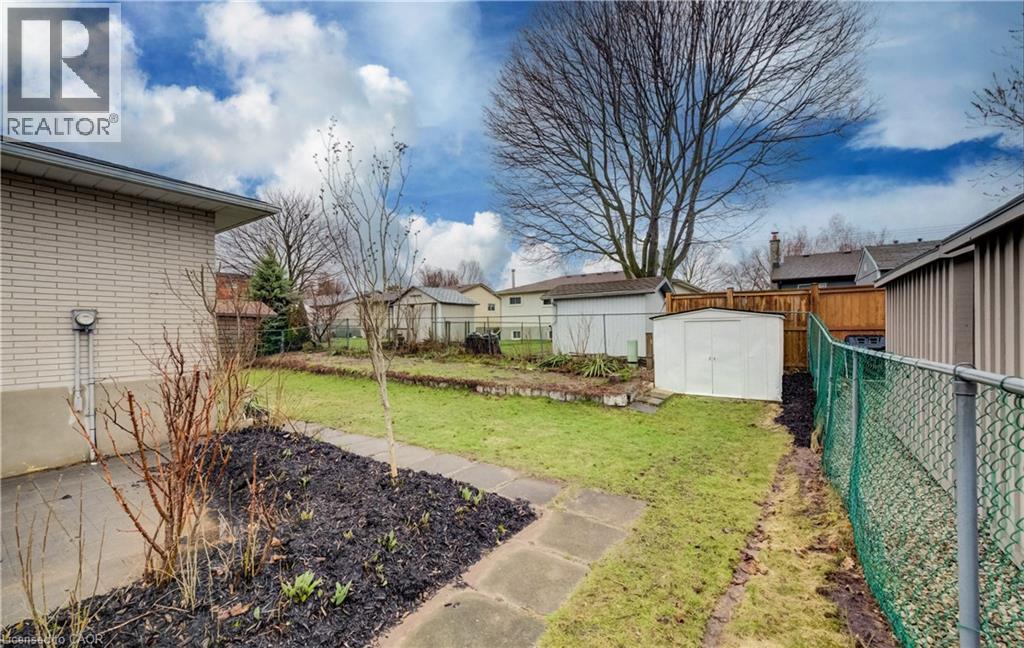 Walk-out to patio with gardens to add your own touch too. - 66 Tupper Crescent, Kitchener, ON - Outdoor